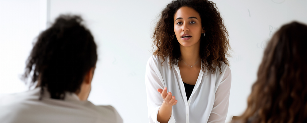 One person conducting a mentorship to two other people