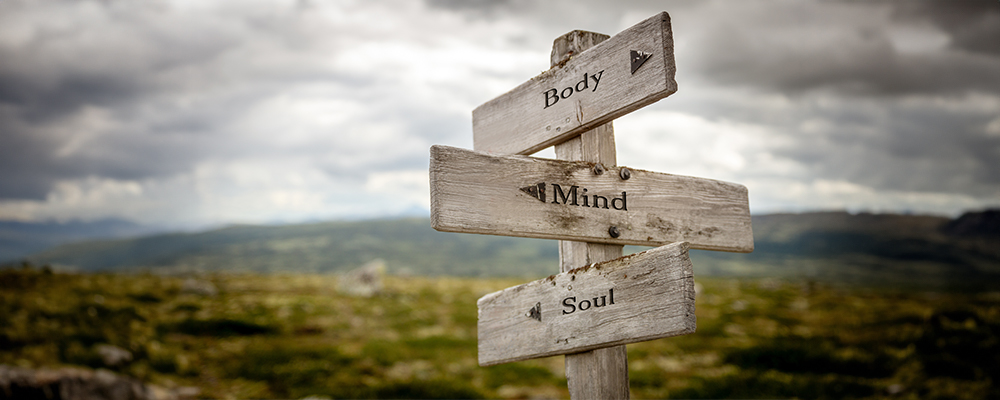 Sign post that shows Hear Mind Body and Soul
